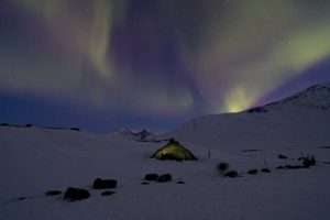 Northern lights in Ruotesvagge. The big tent is our base camp tent a Wigloo from Bergans.