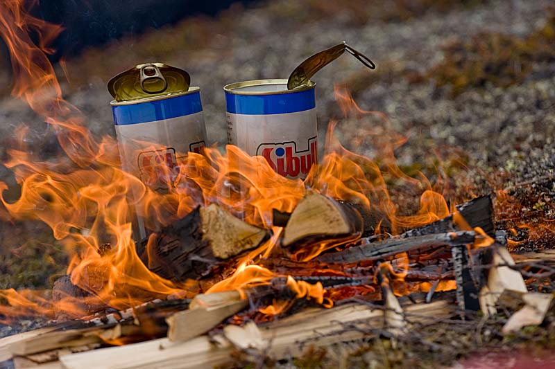 Fire and some hot dogs in a can.