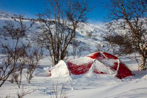 Snow covered hilleberg tent on the dog sled expedition Explore Sarek National Park.
