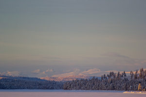 Clear day and mountain view. Swedish Lapland on the dog sled tour: Dog sledding Adventure and Northern lights.