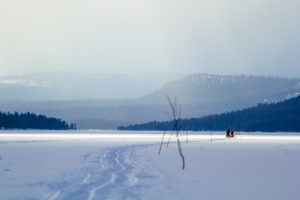 Marked winter trail over lake with dog teams. Photo from The Final Spring adventure.