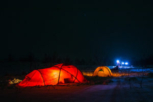 illuminated Hileberg tents on the dog sled adventure called A Taste of Sarek National Park