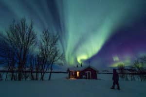 Northern lights Aurora over Sitojaure cabin, Swedish Lapland.