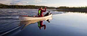 White solo canoe. Lapland Canoe Central. Canoe rental